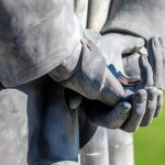 Pennies in the hands of Lincoln's statue for good luck
