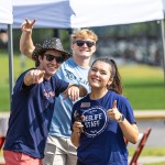 Students greeting others outdoors