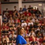 A speaker speaking to a room full of students