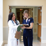 Two medical professionals in conversation.