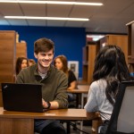 Two people seated at a table