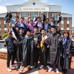 Group of graduates cheering