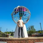 A Cumberlands student stands near the globe on campus