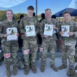 ROTC cadets celebrate completion of a Ruck March 