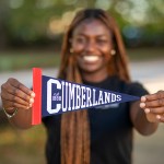 A Cumberlands student shows off the school's pennant 