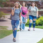 Students walk across campus near Grace Crum on the first day of class