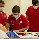 Nursing students work through an examination. 