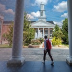 A student walks out of Grace Crum Rollins. 