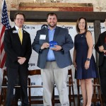 Campus Minister Jacob Ratliff is presented with a Governor's Service Award. 