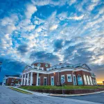 Sun rises over the campus science center. 