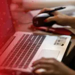 Computer Science Major Working on Laptop