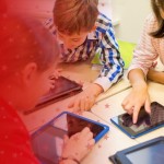 Teacher and Students Working with Digital Technology