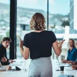 A business woman leads her team in a meeting.