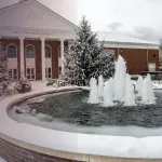 Snow on campus near the fountain. 