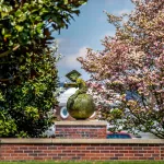 The globe statue in front of the education building. 