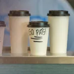 Several cups of coffee on display. 