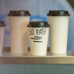 Several cups of coffee on display. 