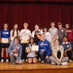 A group of students from the local community presented with a math award. 