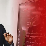 Man Working with AI on Computer Screen