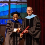 Dr. Sonal Sagar Boda receives his diploma from President Cockrum. 