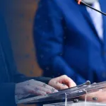 Person Speaking at Podium
