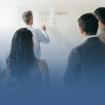 Business Professionals Taking Notes in Meeting