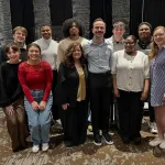 Lisa Bartram stands with a group of students after being recognized by the Association for the Promotion of Campus Activities. 