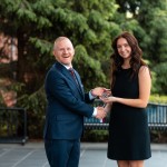President Quentin Young presents an award to the 2026 presidential scholar.
