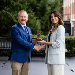 President Young presents an academic award to Joy Kendrick.