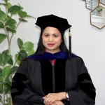 Dr. Saika Anumula posing in her cap and gown. 