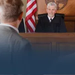Judge with Lawyers in Courtroom
