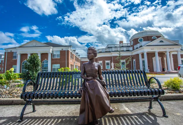 A statue of Marie Curie on the campus at Cumberlands. 
